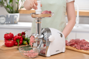 Meat grinder Ardesto, 2000W, prod.-1.9kg/min, 3 cutting plates+for sausag.plates, 3 vegetable slicer, plastik, black-silver