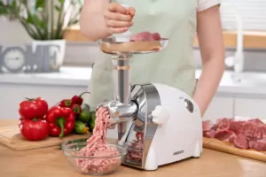 Meat grinder Ardesto, 2000W, prod.-1.9kg/min, 3 cutting plates+for sausag.plates, 3 vegetable slicer, plastik, black-silver